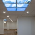 Faux plafond Cumulux par apporter un puits de lumière dans une salle de sport aveugle.
