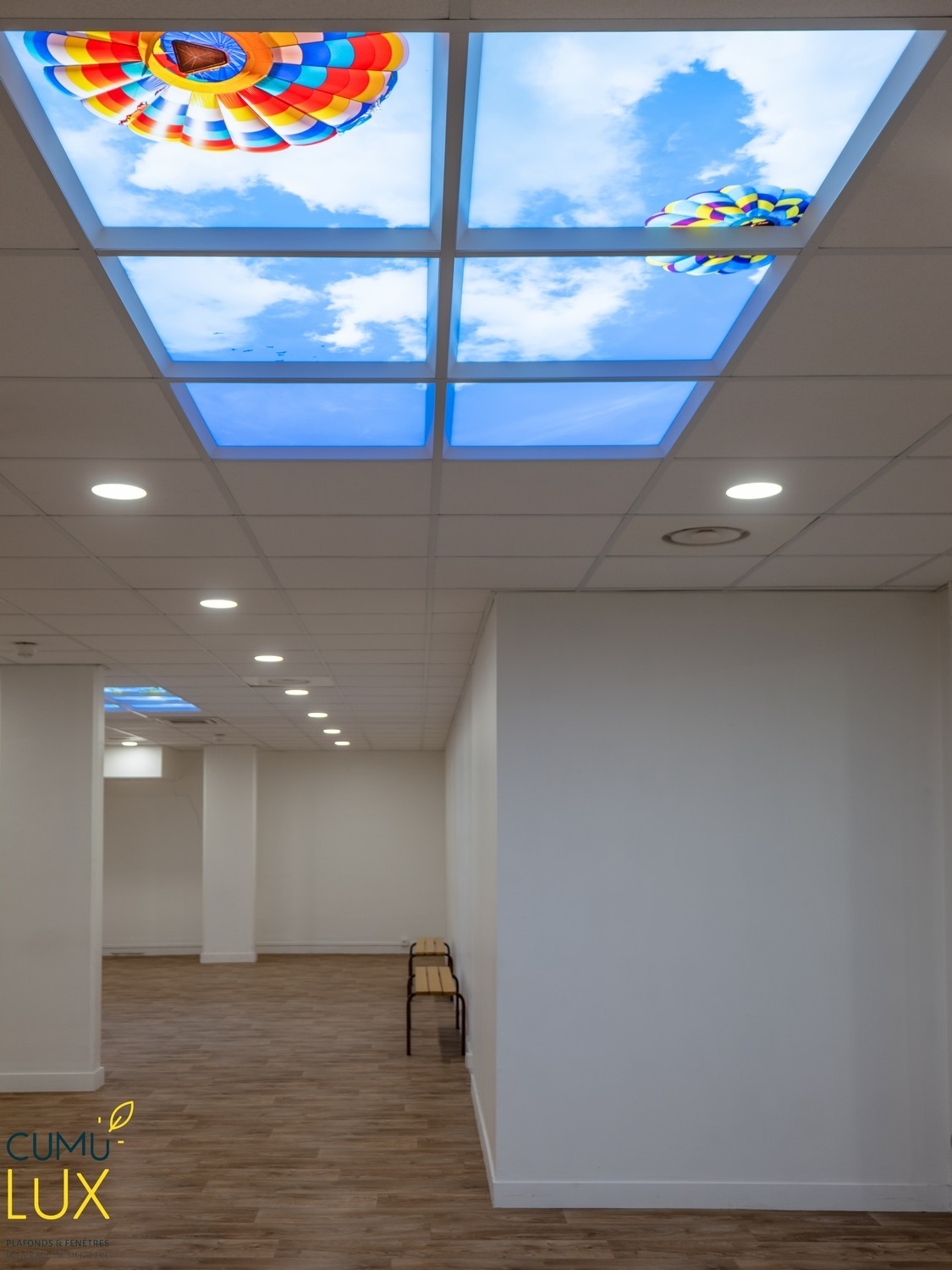 Faux plafond Cumulux par apporter un puits de lumière dans une salle de sport aveugle.